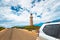 Cape Du Couedic lighthouse by the road with SUV driving by