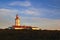 Cape Espichel lighthouse on sunset light