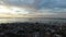 Cape Town, city and landscape with sea from drone in blue sky, cbd or cityscape at sunset. Travel, South Africa or