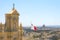 Capital city Victoria top view from Cathedral of the Assumption, Gozo with Maltese flag. Island city architecture panorama