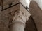 Capital engraved in the stone in the church of St. Antimo in Tuscany, Italy.