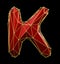 Capital latin letter K in low poly style red and gold color isolated on black background. 3d