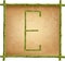 Capital letter E made of green bamboo sticks on old paper background