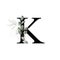 Capital letter K decorated with golden flower and leaves. Letter of the English alphabet with floral decoration. Green foliage