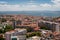 The capital of Portugal, Lisbon, top view of the orange roofs of houses, hotels, the sea coast