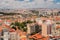 The capital of Portugal, Lisbon, top view of the orange roofs of houses, hotels, the sea coast