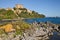 Capodimonte, Viterbo, Lazio, Italy: landscape of the Lake Bolsena and the ancient village with the fortress Rocca Farnese