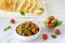 Caponata or ratatouille from a variety of vegetables served with ciabatta and olive.