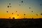 Cappadocia, Goreme, Anatolia, Turkey: Hot air balloon ride sunset silhouettes view. Sunset hot air balloon silhouette. Sunset hot