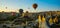 Cappadocia, Goreme, Anatolia, Turkey: Scenic vibrant view of balloons flight in Cappadocia valley in sunrise rays