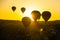 Cappadocia, Goreme, Anatolia, Turkey: The silhouette of the balloon against the yellow sky. Beautiful dawn in the