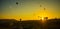 Cappadocia, Goreme, Anatolia, Turkey: The silhouette of the balloon against the yellow sky. Beautiful dawn in the