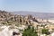 Cappadocia, Turkey. The lower part of the rock - fortress Uchisar and the surrounding picturesque valley