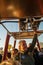 Cappadocia, Turkey - September 14, 2021: A hot air balloon pilot navigates his balloon through the sky near Goreme in the