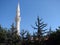 Cappadocia. Turkey. View of the minaret tower of the Islamic mosque against the morning blue sky.