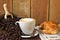 Cappuccino, brioches and newspaper with background