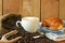 Cappuccino, brioches and newspaper with background