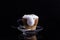 Cappuccino coffee in a glass cup, foam over the edge