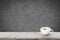 Cappuccino coffee on wooden floor with blurred image of abstract background.