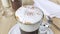 Cappuccino or latte in cup. White froth milk is sprinkled with ground cinnamon and cocoa powder. Dessert drink decoration. Instant