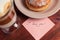 Cappuccino mug, cake and notes I love you on a wooden background. Concept Valentine Day