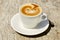 Cappuchino or latte coffe in a white cup with