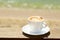 Cappuchino or latte coffe in a white cup with