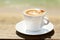 Cappuchino or latte coffe in a white cup with