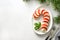 Caprese candy cane salad is holiday appetizer on white . View from above.