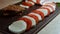 Caprese - italian national dish. Sliced tomatoes and mozarella arranged in shape of Christmas candy cane. Seasoning with