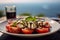 a Caprese salad, with a blurred backdrop of the beautiful Amalfi Coast.