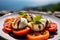 a Caprese salad, with a blurred backdrop of the beautiful Amalfi Coast.