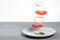 Caprese salad is an Italian classic. Ingredients cheese and tomatoes fly in the air.