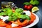 Caprese salad. Italian traditional caprese salad ingredients. Mediterranean food. Italian salad.