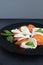 Caprese salad on a large black plate