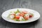 Caprese salad with mini mozzarella balls and