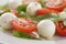 Caprese salad with mini mozzarella balls and