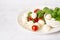 Caprese salad. Skewers with tomato and mozzarella with basil