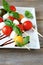 Caprese salad on wooden sticks