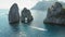 Capri and iconic Faraglioni rocks seen from the Tyrrhenian Sea. Aerial view of summer seascape in Italy.