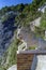 CAPRI, ITALY, 1967 - A marble lion watches over the park of the Gardens of Augustus in Capri