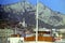 CAPRI, ITALY 1970 - The mast of a ship in the port of Capri stands out against the mountain of Anacapri