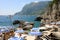 CAPRI, ITALY - JULY 4, 2018: rocky beach between Faraglioni cliffs of Capri, Italy