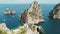 Capri's Dramatic Seascapes and Faraglioni Rocks View. Aerial view of Mediterranean sea in Summer Italy. Iconic