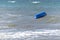Capsized inflatable boat in the sea