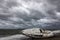 Capsized sailboat on the beach