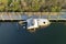 Capsized sunken sailing boat left forsaken on shallow bay waters after hurricane Ian in Manasota, Florida