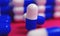 Capsule medicine pills, health pharmacy concept. Drugs for treatment medication. Heap of blue white color capsules on pink backgro