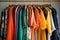 capsule wardrobe full of vibrant and colorful clothing