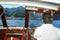 Captain driving a boat in front of Orta on lake Orta